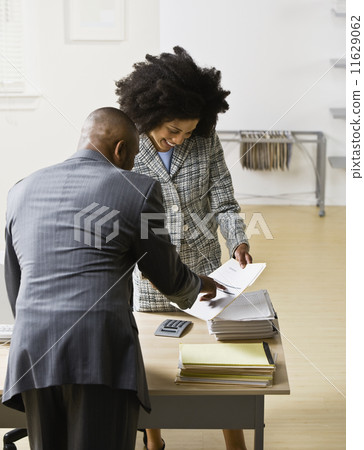 African American businesspeople looking at paperwork 11629062