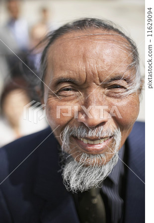 Close up of senior Asian man with beard 11629094