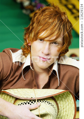 Close up of male teenager with straw hat 11629134