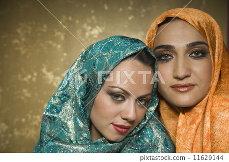 Middle Eastern women wearing head scarves Middle Eastern women wearing head scarves 11629144