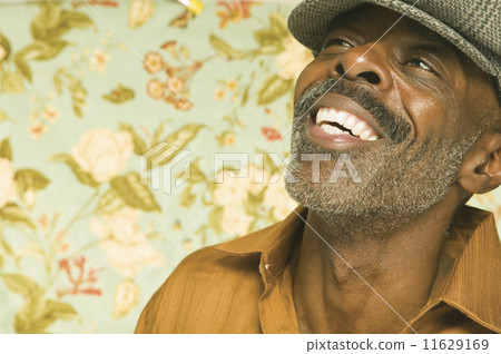 Middle aged man laughing for the camera 11629169