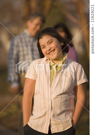 Hispanic girl with hands in pockets 11629221
