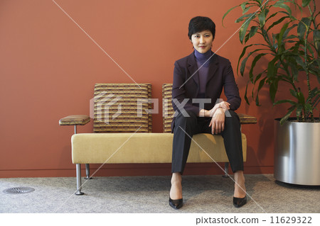 Asian businesswoman in waiting area 11629322