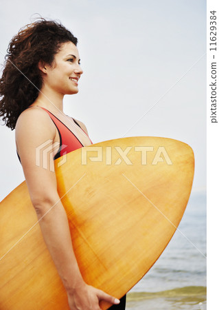 Young woman holding boogie board Young woman holding boogie board 11629384