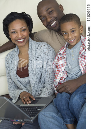 Portrait of African family with laptop 11629436