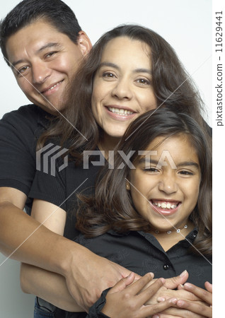 Hispanic family hugging 11629441