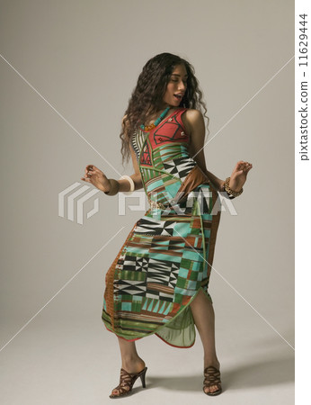 Studio shot of Asian woman dancing Studio shot of Asian woman dancing 11629444