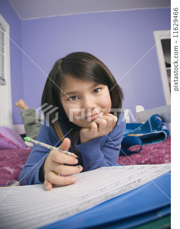 Asian girl doing homework 11629466