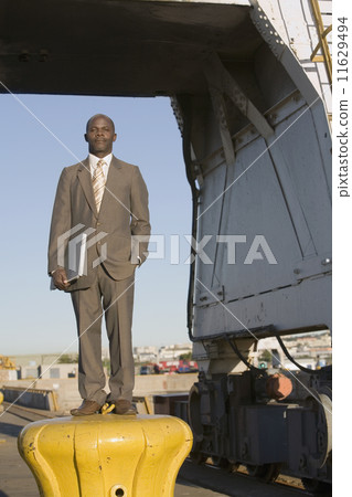 African American businessman holding laptop 11629494