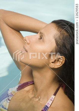 Close up of Indian woman in swimming pool Close up of Indian woman in swimming pool 11629563
