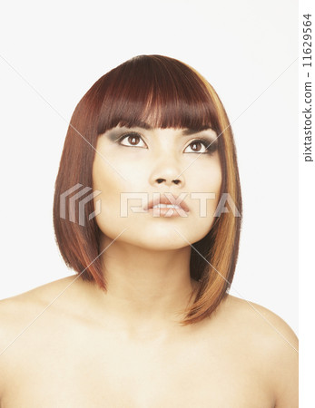 Pacific Islander woman looking up Pacific Islander woman looking up 11629564