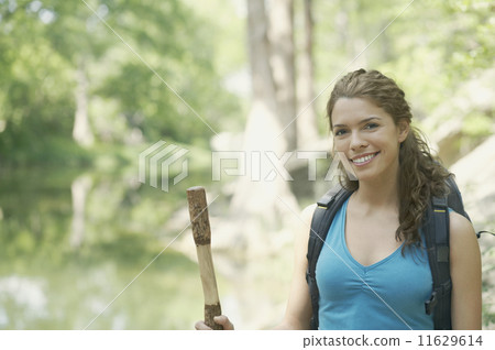 Young woman hiking in a forest 11629614