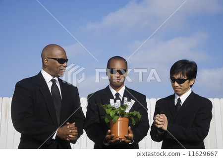 Multi-ethnic businessman with money plant 11629667