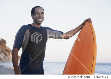 African man holding surfboard African man holding surfboard 11629671
