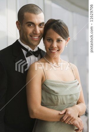 Hispanic couple in evening wear 11629706