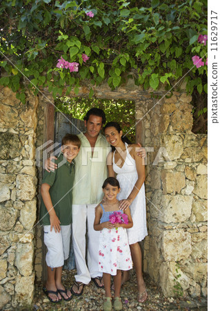 Hispanic family in garden doorway 11629717