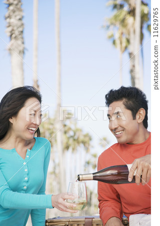 Asian couple drinking wine 11629765