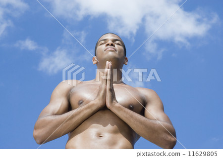 Bare-chested African man meditating Bare-chested African man meditating 11629805