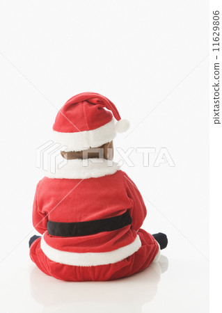 Rear view studio shot of baby wearing Santa Claus outfit Rear view studio shot of baby wearing Santa Claus outfit 11629806