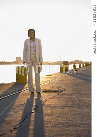 African American businesswoman on commercial pier African American businesswoman on commercial pier 11629813