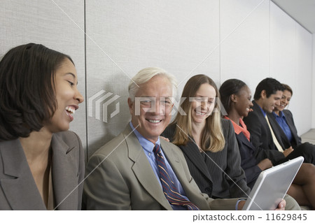 Multi-ethnic businesspeople working on laptops 11629845