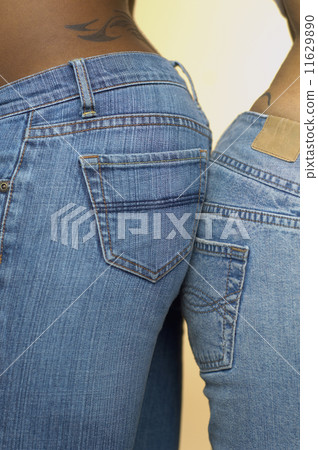 Close up of African couple's rear ends touching 11629890