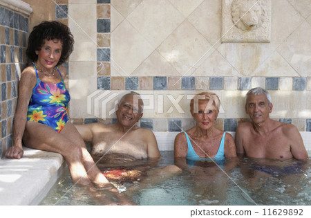 Group of seniors in hot tub 11629892