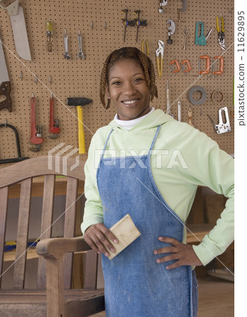 African American woman in woodworking shop African American woman in woodworking shop 11629895