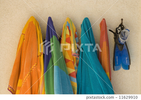 Still life of beach towels on hooks Still life of beach towels on hooks 11629910
