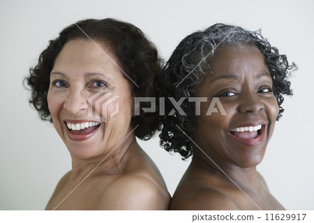 Two senior African women with bare shoulders Two senior African women with bare shoulders 11629917