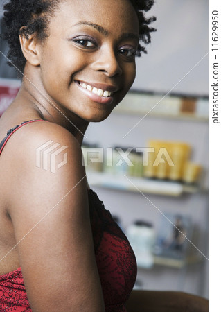 African woman looking over shoulder 11629950