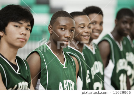 Basketball players standing in row Basketball players standing in row 11629966