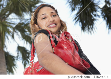 African woman holding handbag African woman holding handbag 11629995