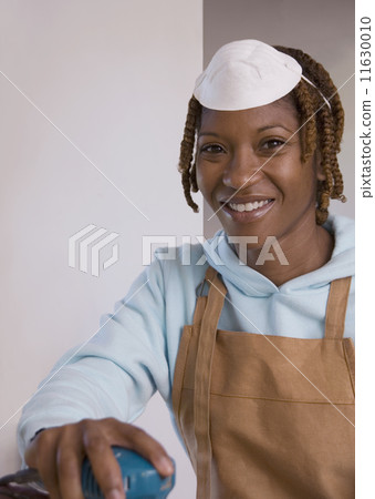 African American woman wearing woodworking mask 11630010