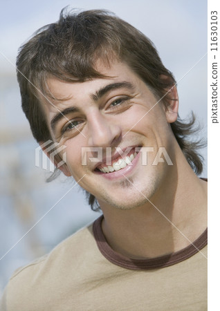 Close up of young man smiling Close up of young man smiling 11630103
