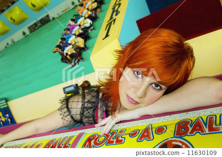 Young Hispanic woman leaning carnival game Young Hispanic woman leaning carnival game 11630109
