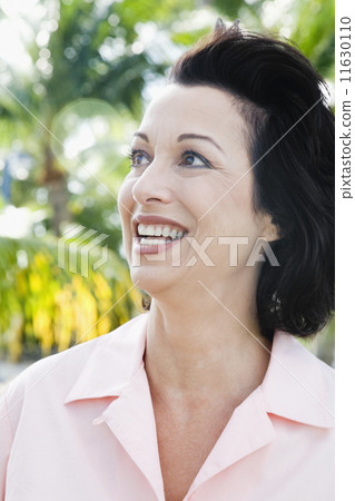 Hispanic woman looking to side 11630110
