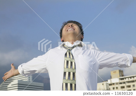 Asian businessman with arms outstretched 11630120