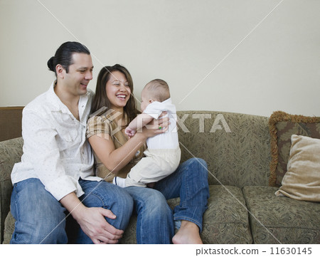 Asian parents smiling at baby 11630145