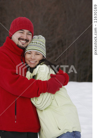 Mixed Race couple hugging 11630169