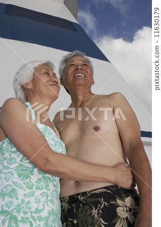 Senior Asian couple hugging 11630179