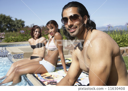 Multi-ethnic women looking at Indian man 11630408