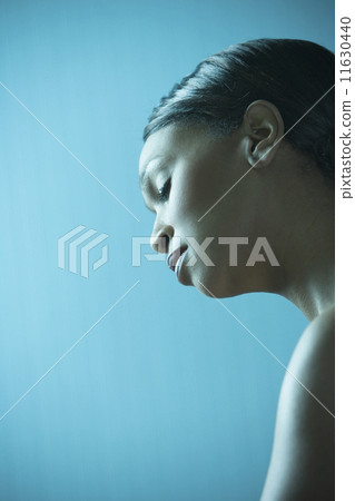 African woman with bare shoulders and eyes closed African woman with bare shoulders and eyes closed 11630440