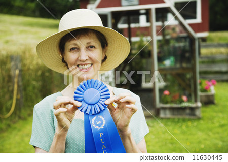 Woman holding blue ribbon Woman holding blue ribbon 11630445
