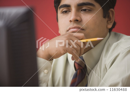 Businessman working on a computer 11630488