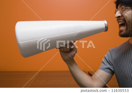 Man yelling into megaphone 11630553