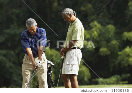 Multi-ethnic men playing golf Multi-ethnic men playing golf 11630586