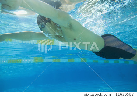 Underwater shot of Asian man swimming Underwater shot of Asian man swimming 11630598