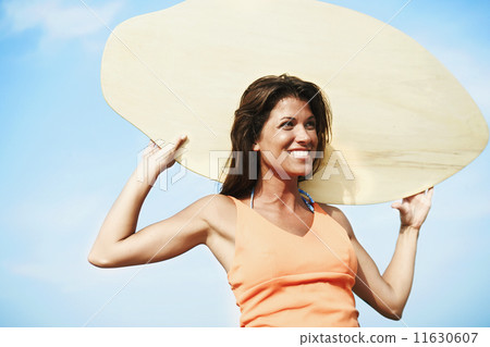 Young woman holding boogie board Young woman holding boogie board 11630607