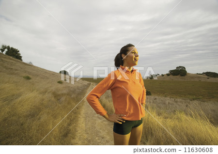 Portrait of woman jogging in country Portrait of woman jogging in country 11630608